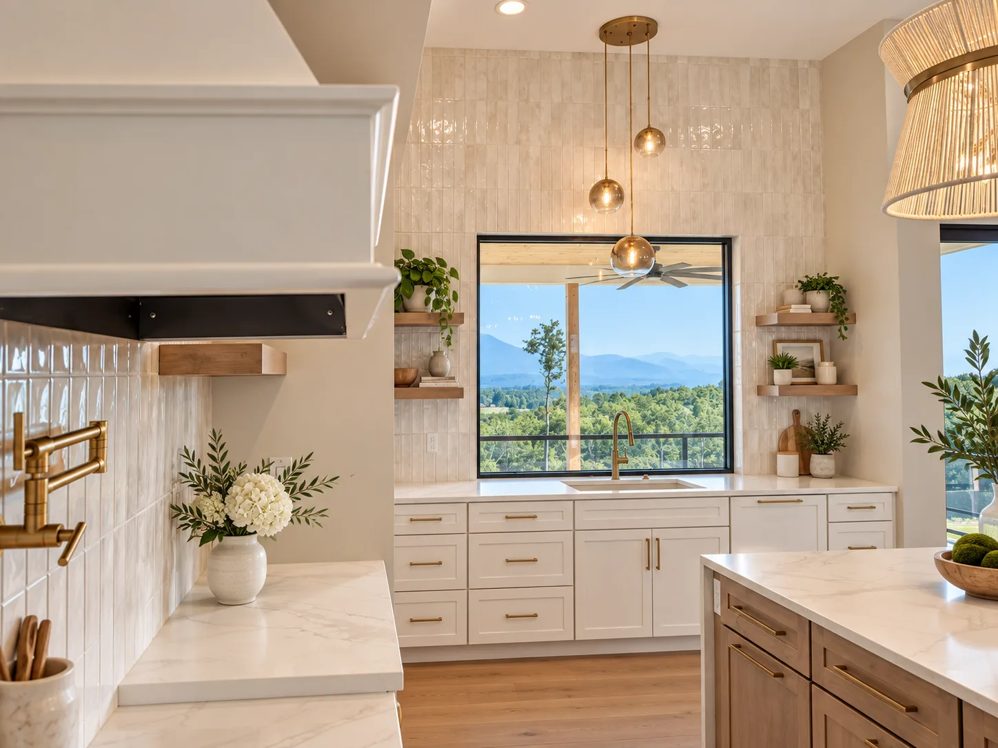 Alabaster kitchen with custom hood and floating shelves framing the mountain view