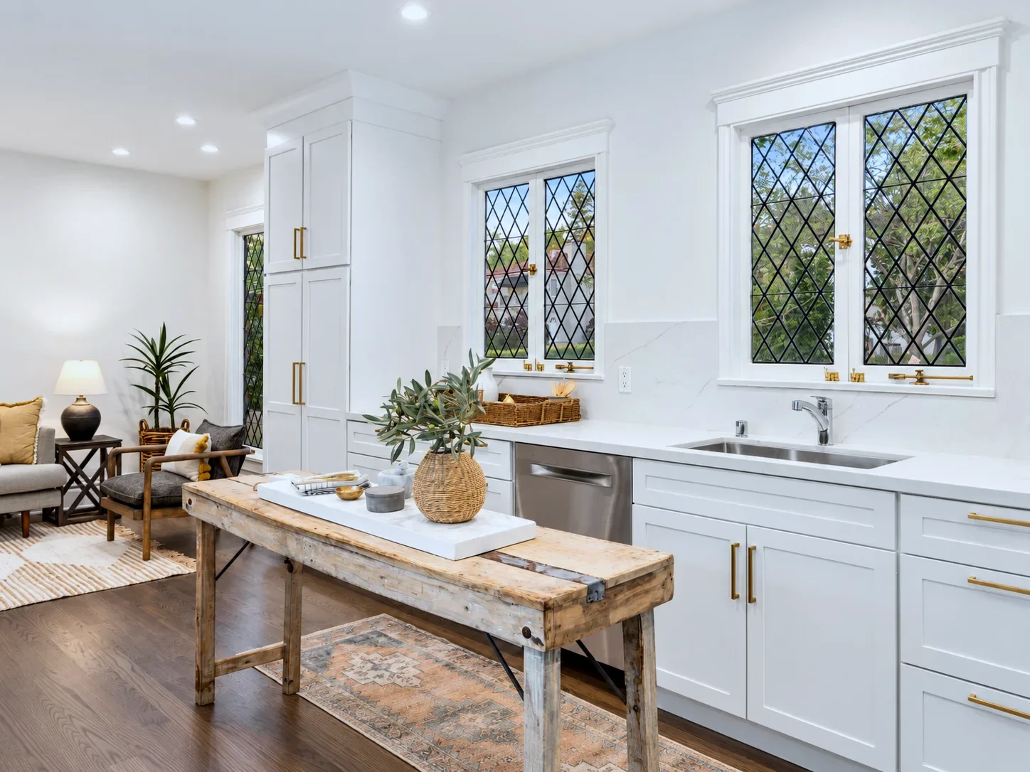Alabaster cabinetry wrapped around leaded glass windows