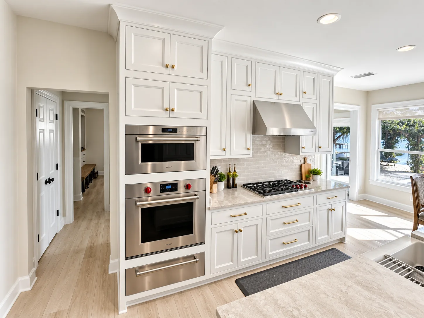 Double ovens and range wall in beaded frame inset cabinetry