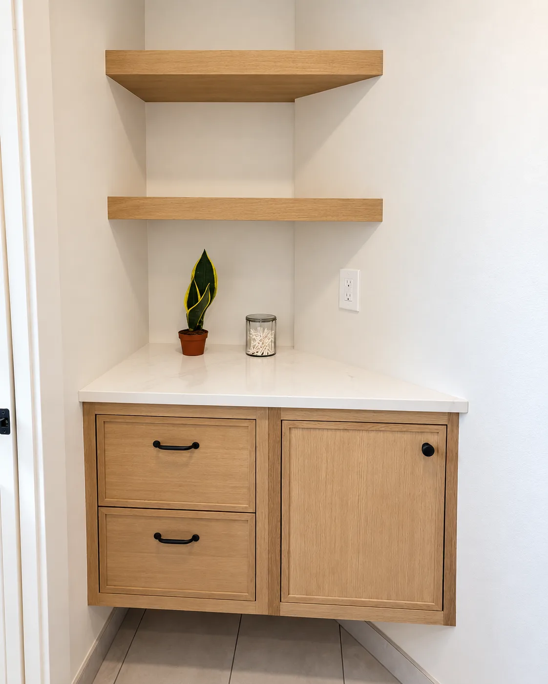 Floating oak shelves over a fitted corner base in the bath
