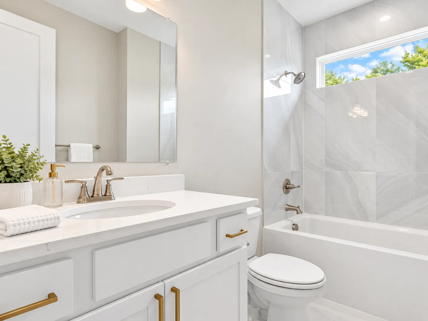 Guest bath vanity in Bristol Alabaster with brass pulls