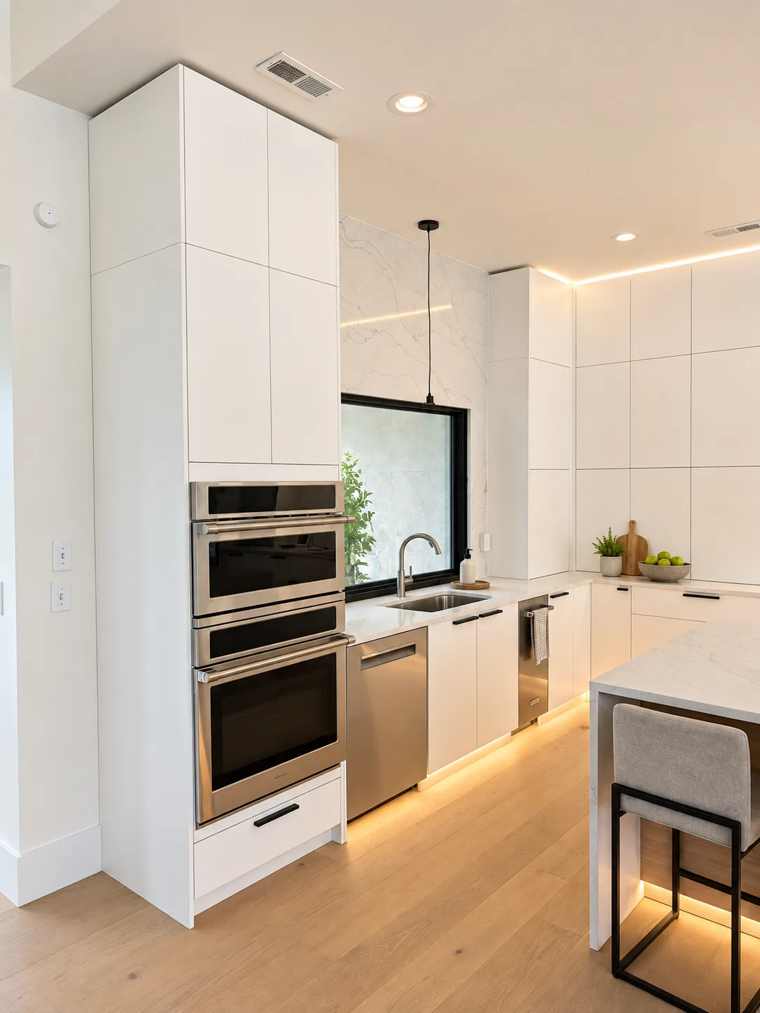 White slab working wall with integrated ovens and lighting