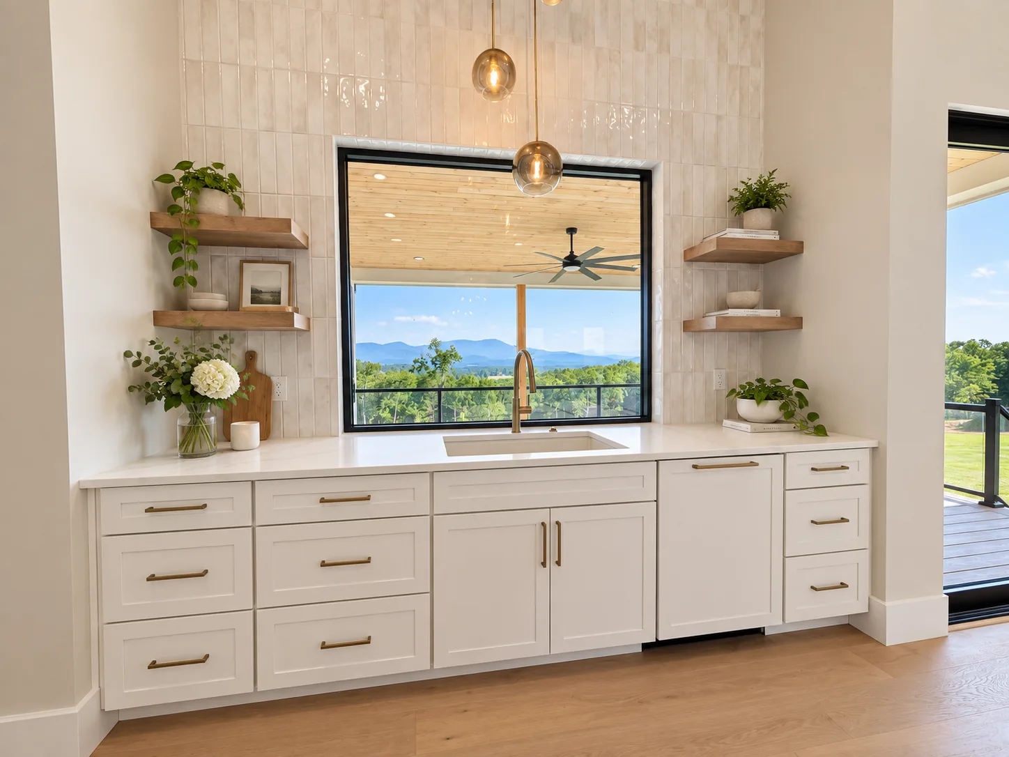 Sink wall with floating shelves and a mountain view window