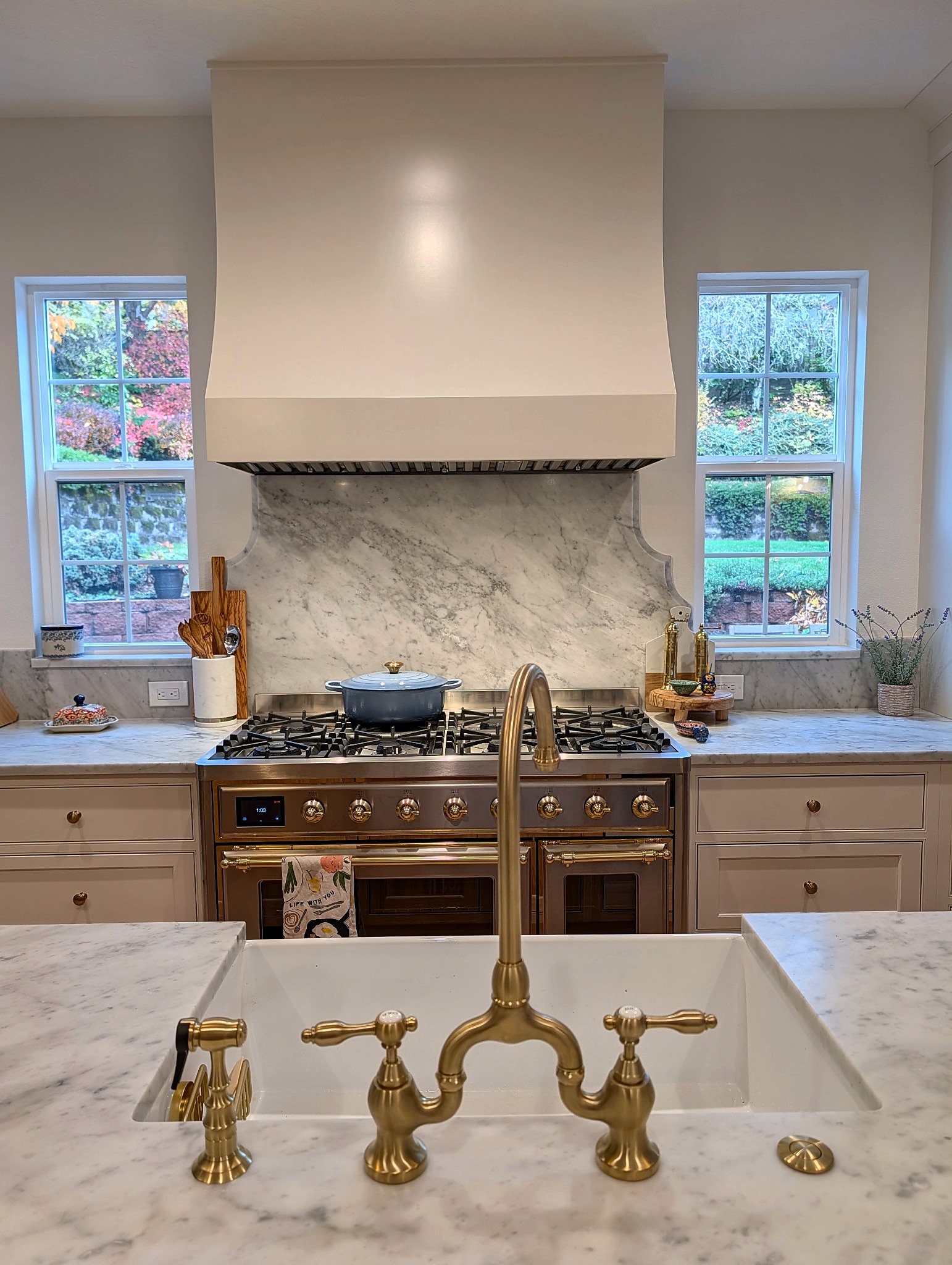 Range and prep area in Marshmallow Cream beaded inset with brass fixtures