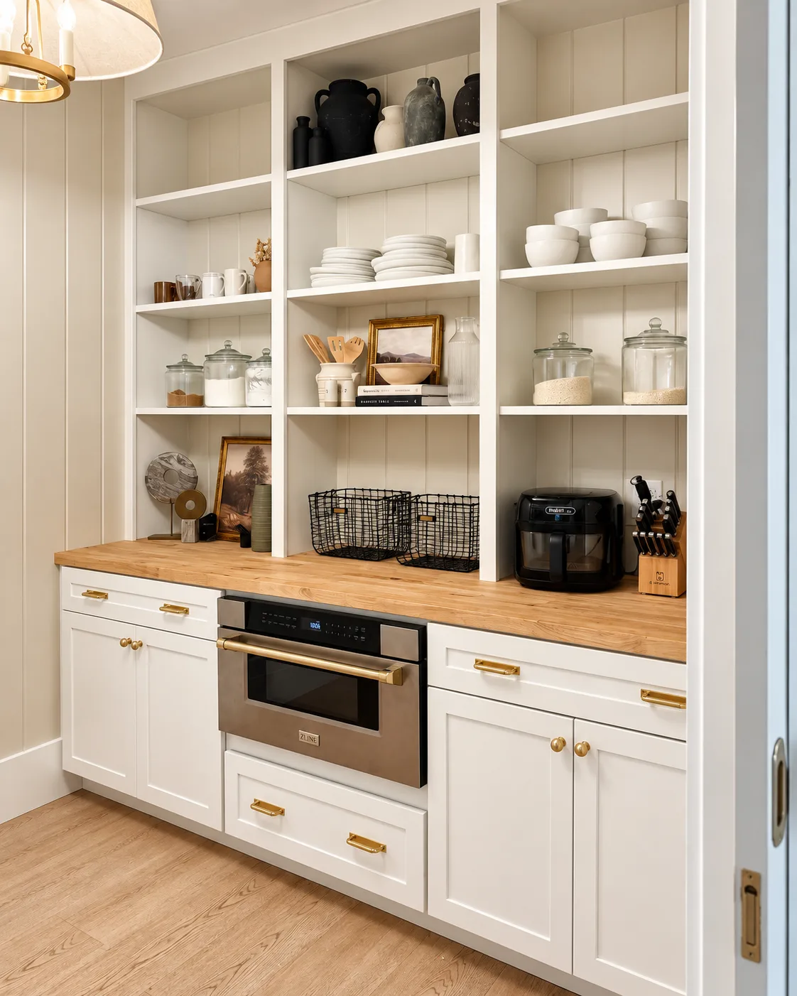Pantry wall with open shelving and microwave