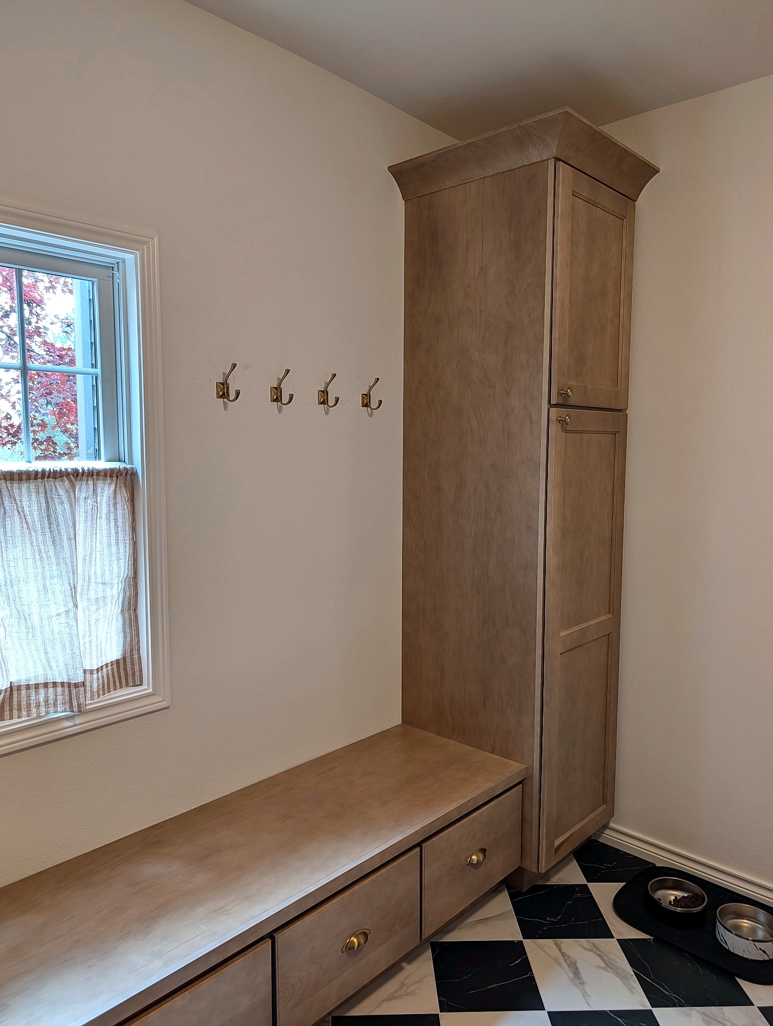 Mudroom bench on the checkerboard floor