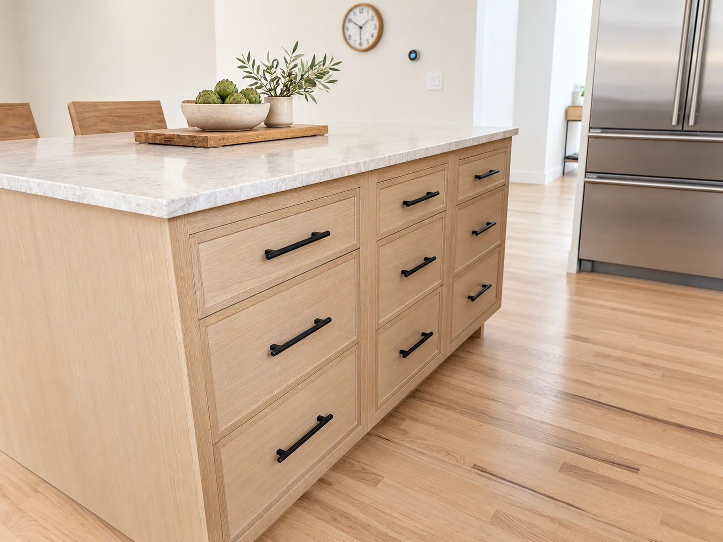 Island drawer detail in Straw rift white oak with black hardware