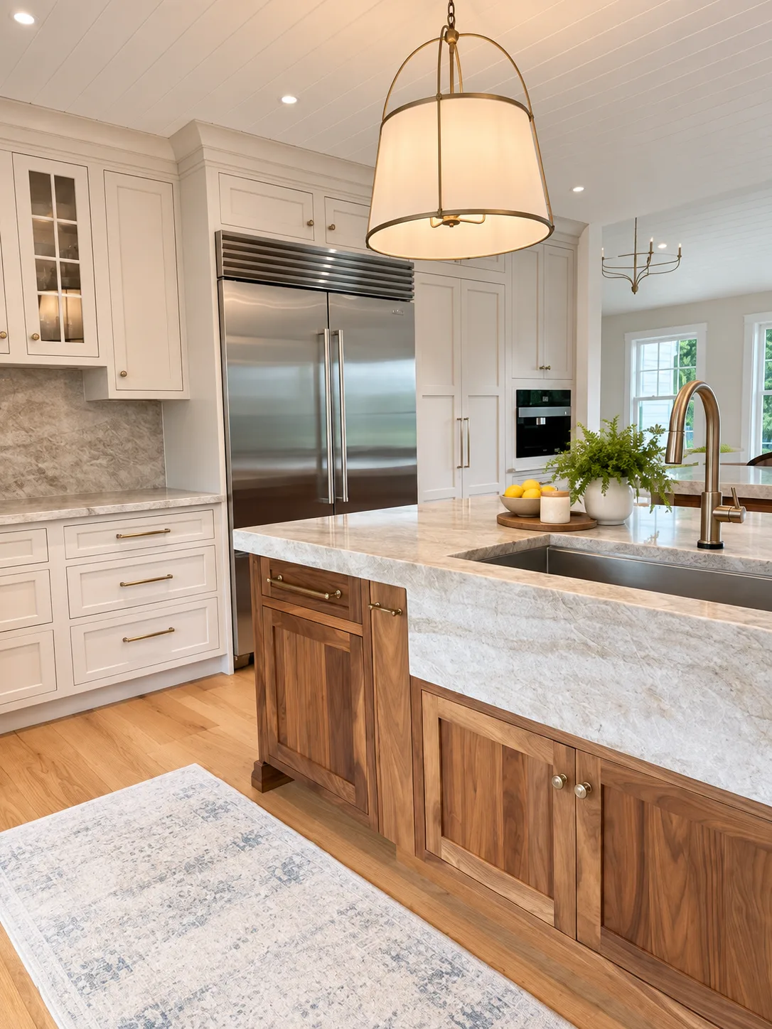 Sink corner with Mushroom cabinetry and walnut island