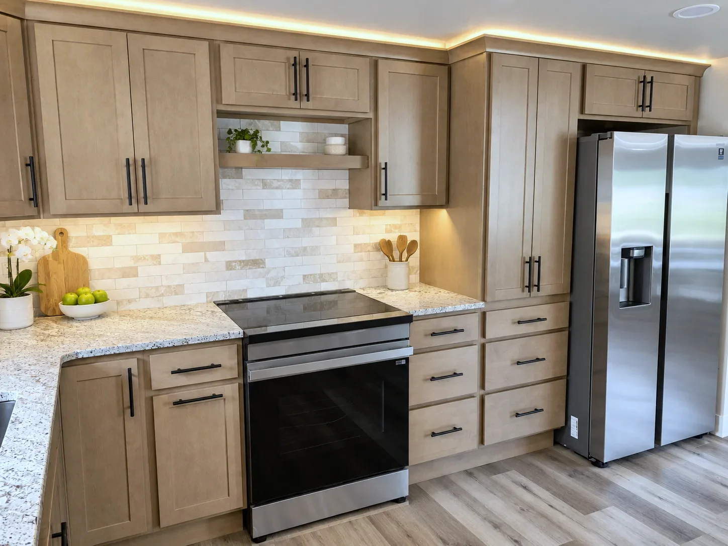Range wall with slab drawer fronts in Element on Maple and lighting above the cabinets, Colorado Springs
