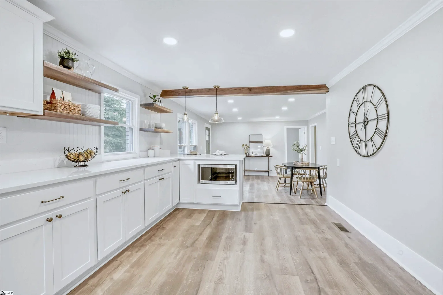 Kitchen peninsula with built-in microwave and wood open shelving, Alabaster Bristol cabinets, South Carolina