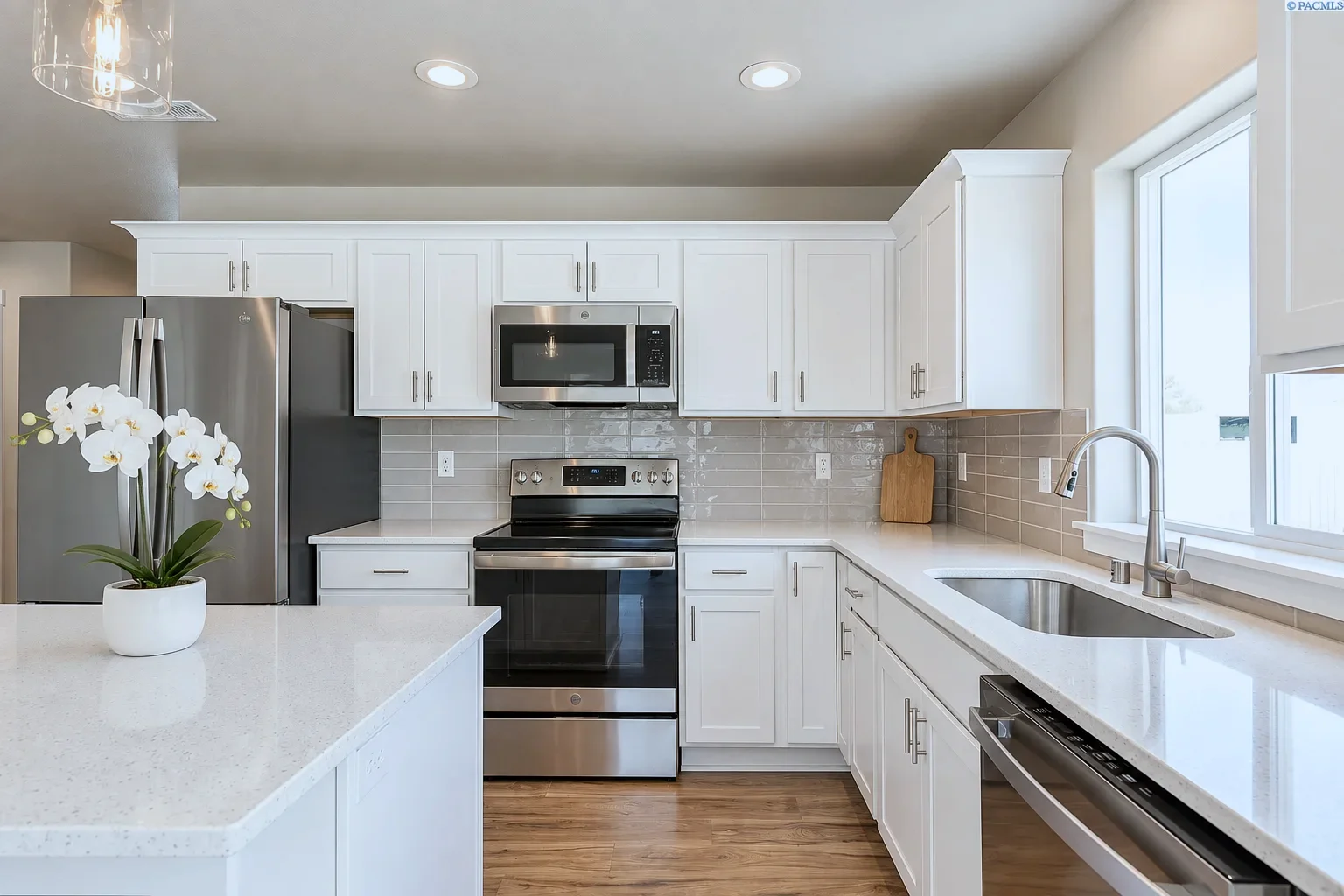 Range wall and corner sink run with Bristol doors in Alabaster, Kennewick WA spec home kitchen