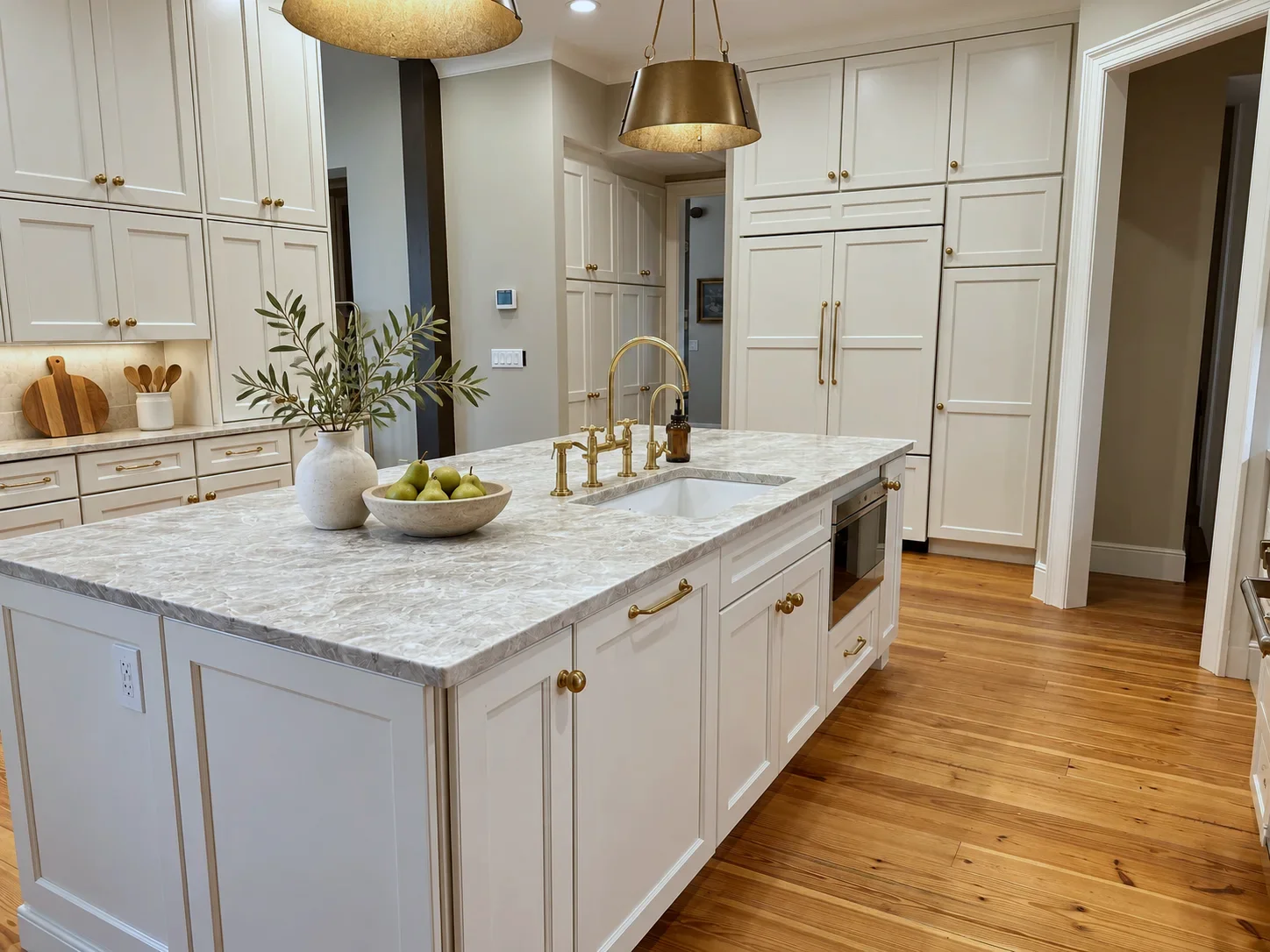 Quartzite island with brass bridge faucet and built-in microwave, Manchester doors in Awe paint, North Carolina