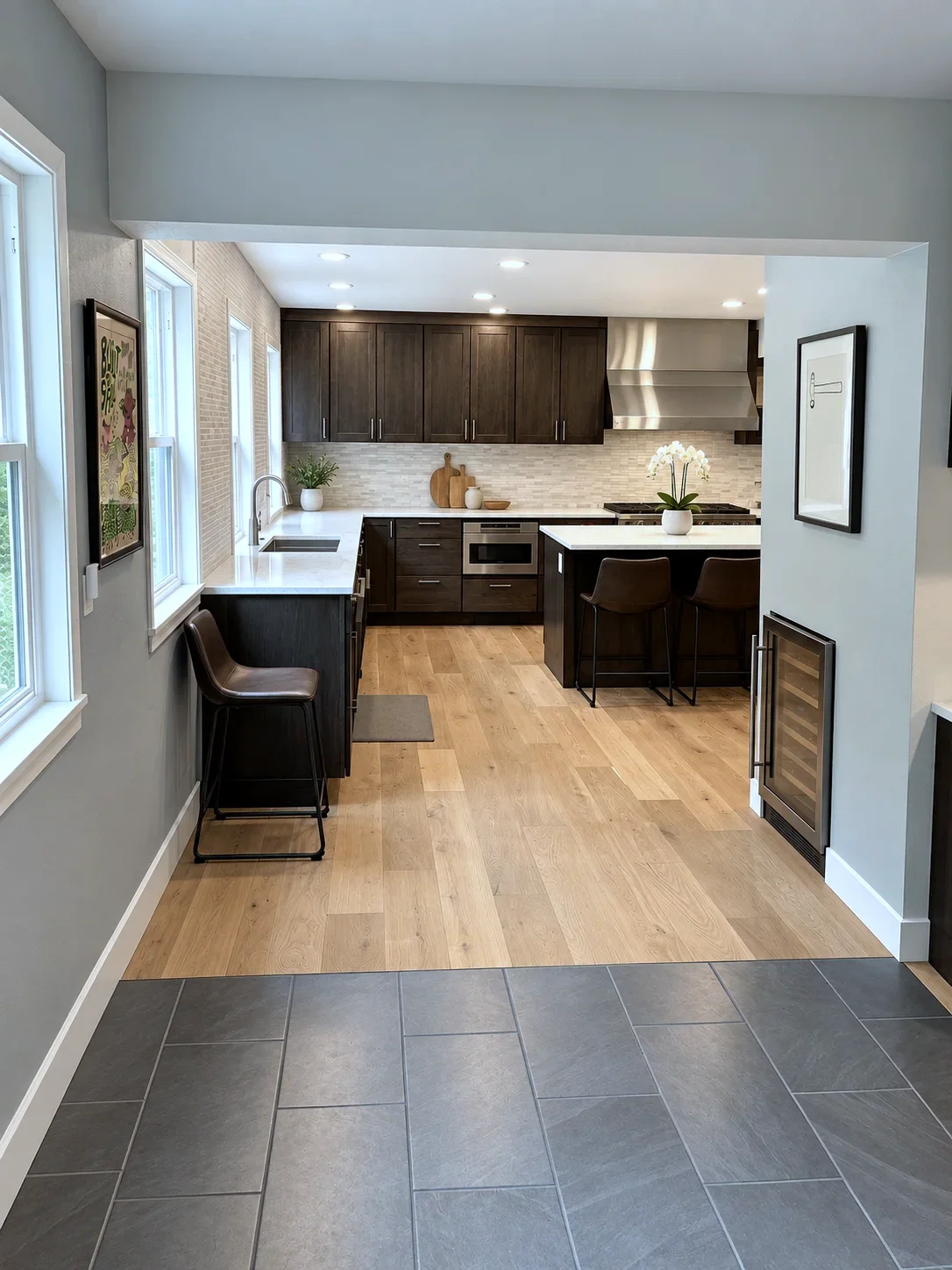 Entry view into Nocturnal stained oak kitchen with wine fridge and white oak floors, NW Portland remodel