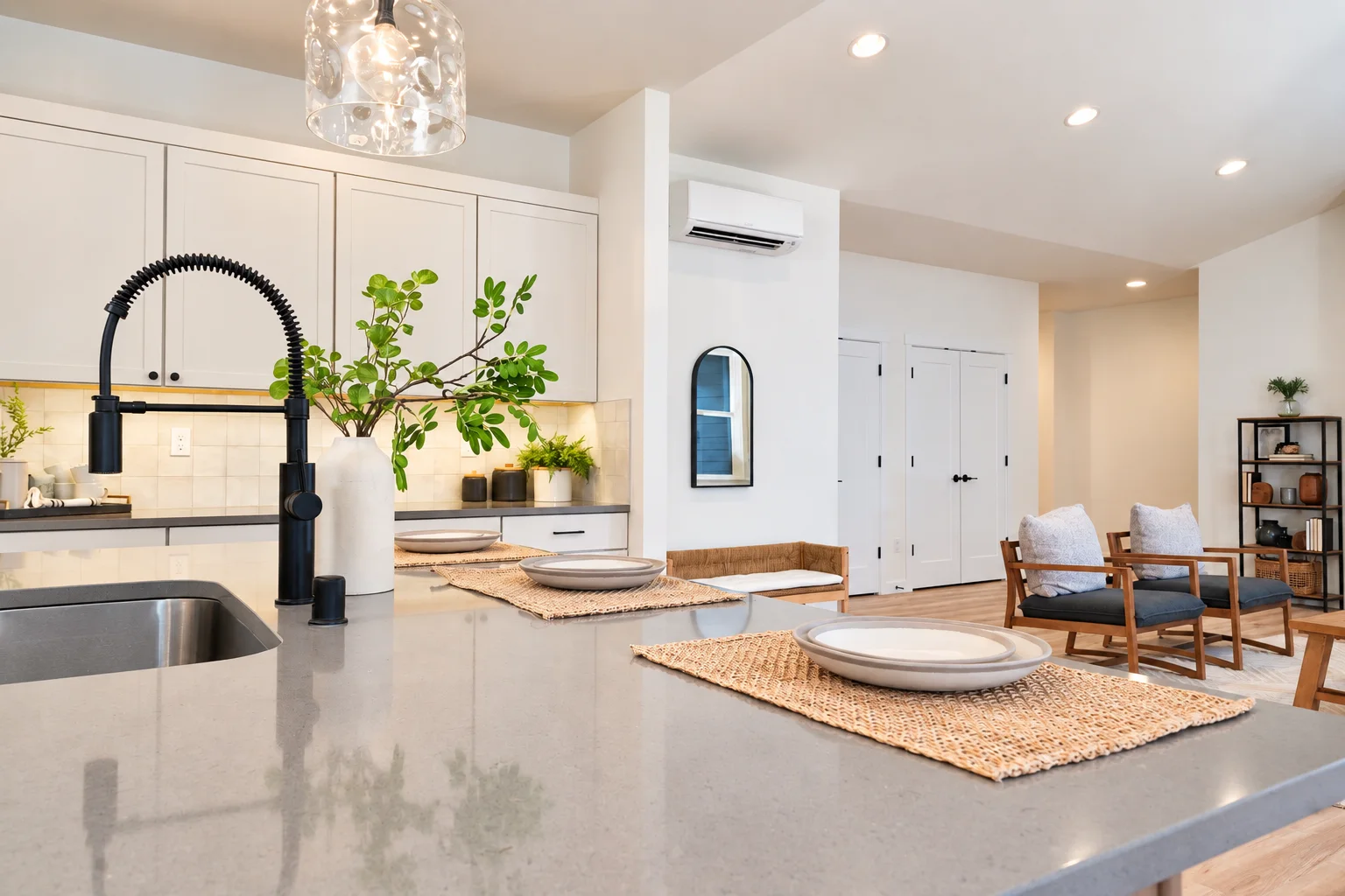 Element on Maple island with gray quartz and black faucet, northwest Washington spec home