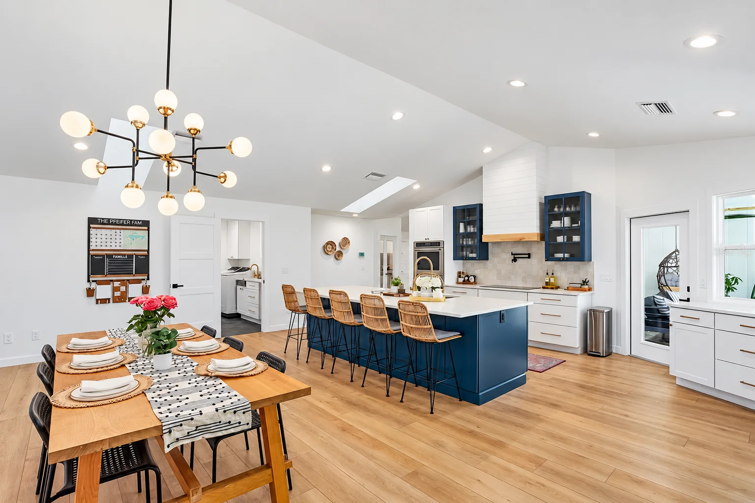Sarasota kitchen remodel with navy island and white cabinets