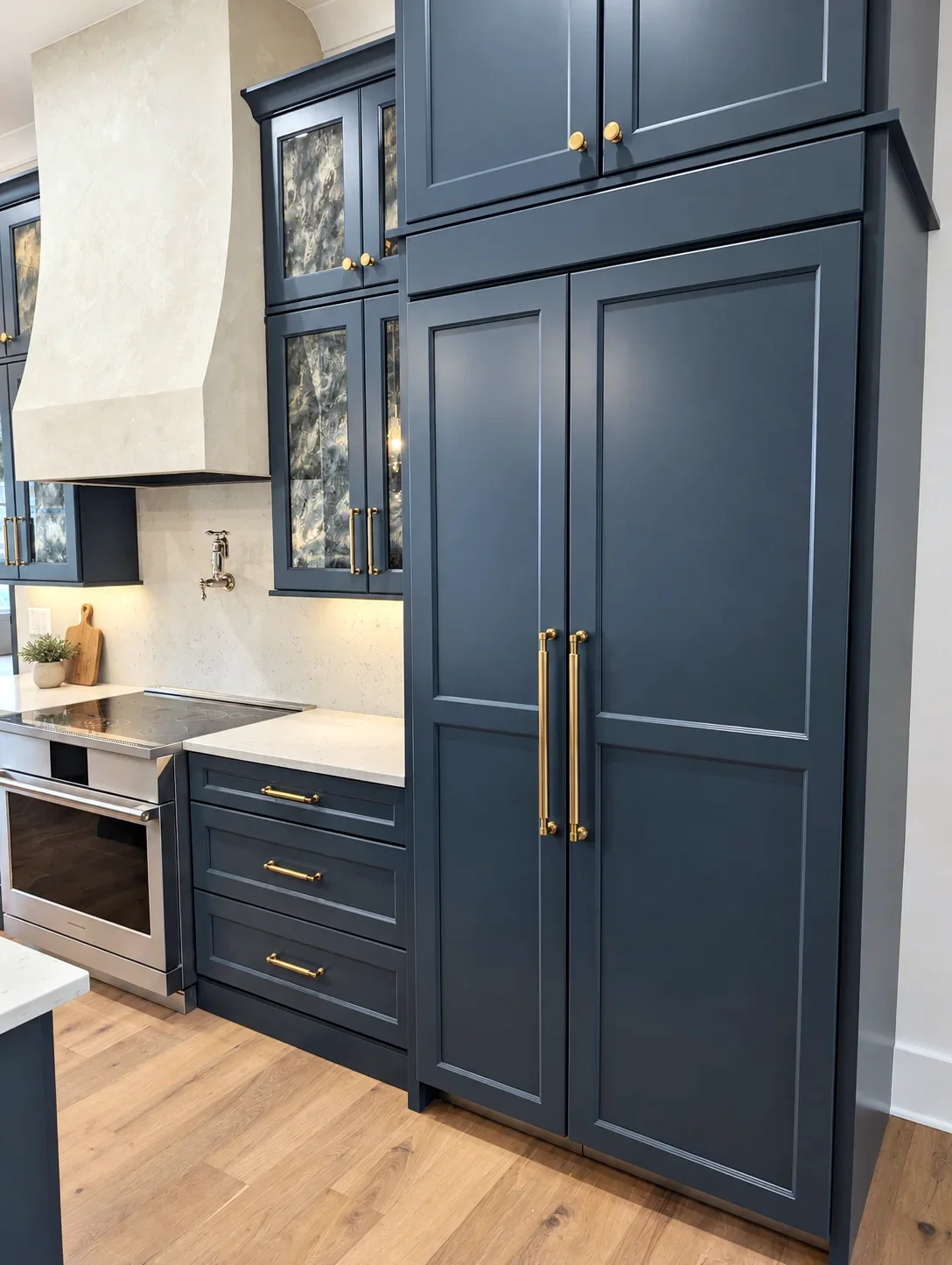 Custom Blue tall cabinet wall with glass uppers and brass pulls, Manchester doors, South Carolina custom home