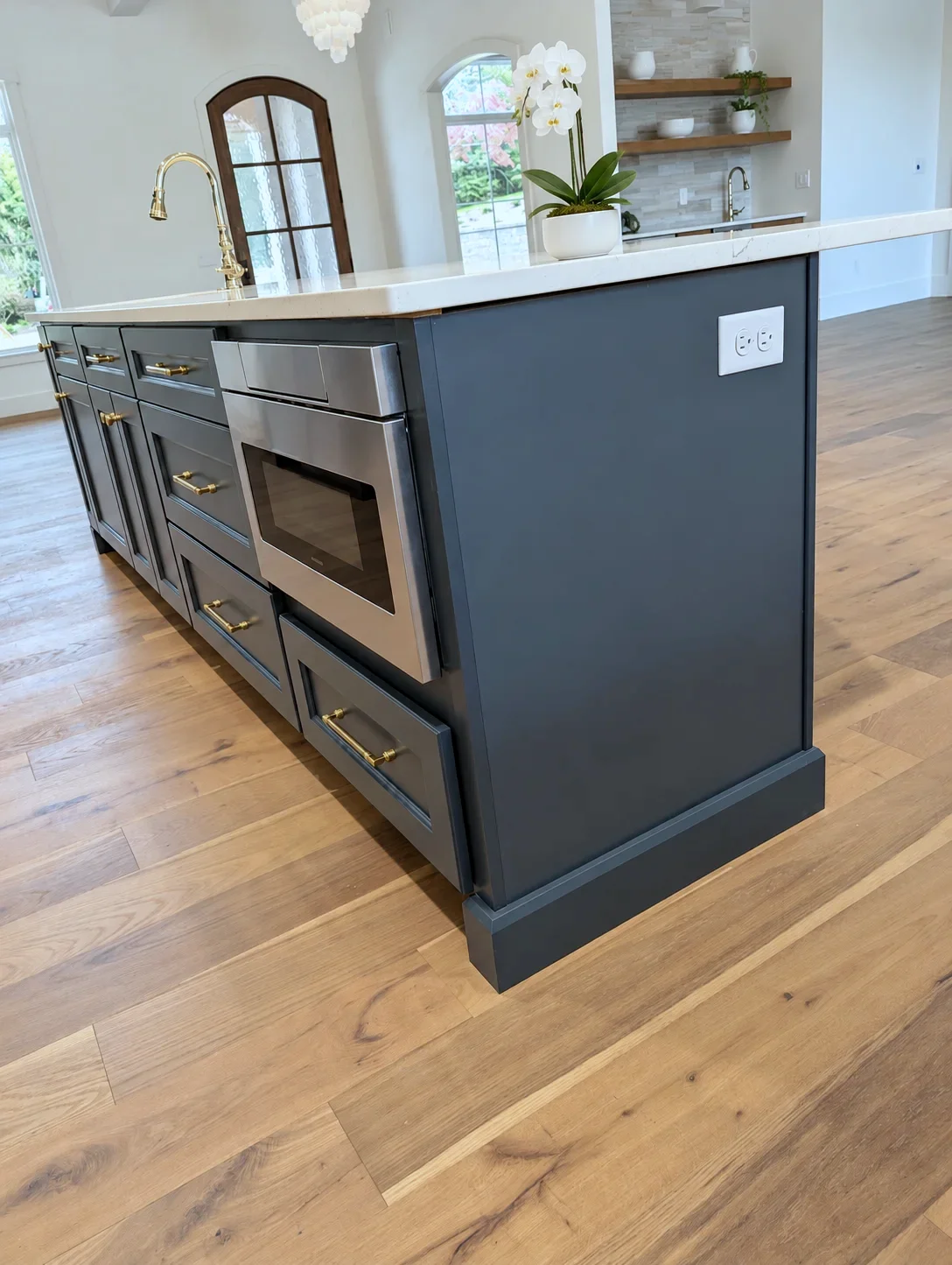 Microwave drawer built into the Custom Blue island, South Carolina custom home kitchen