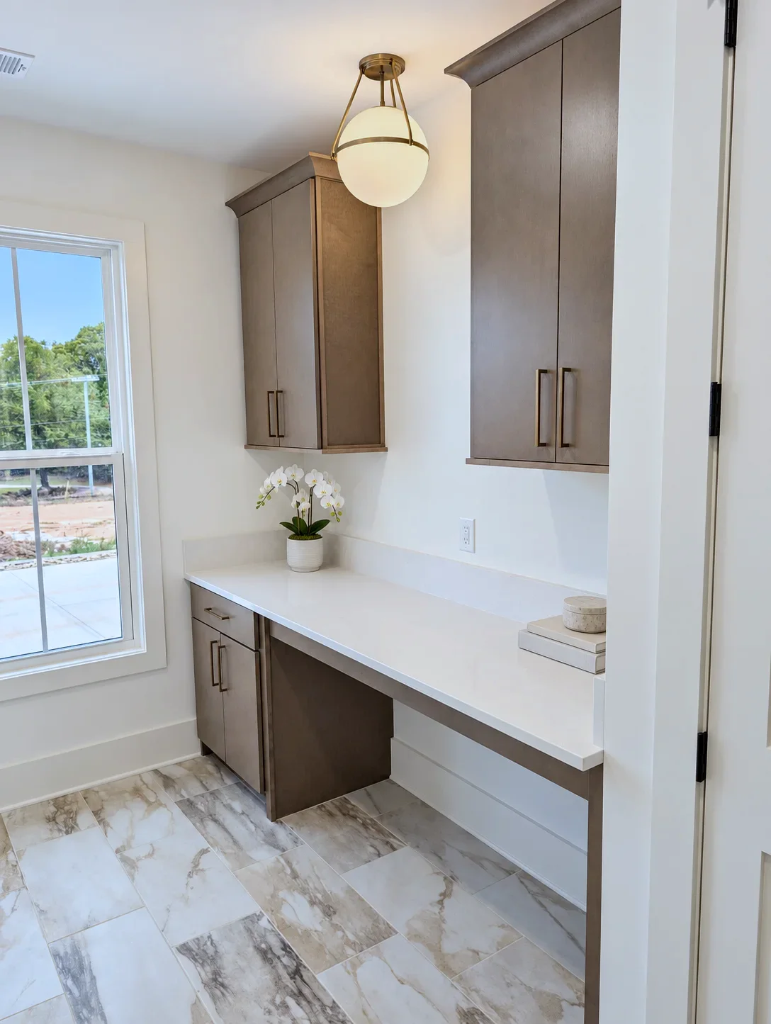 Laundry room with Truro doors in Element on Maple and built-in folding counter, South Carolina